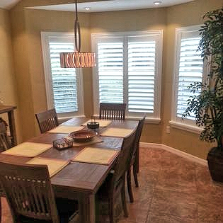 Dinning room bay window with shutters