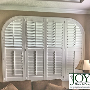 Shutters in arched window